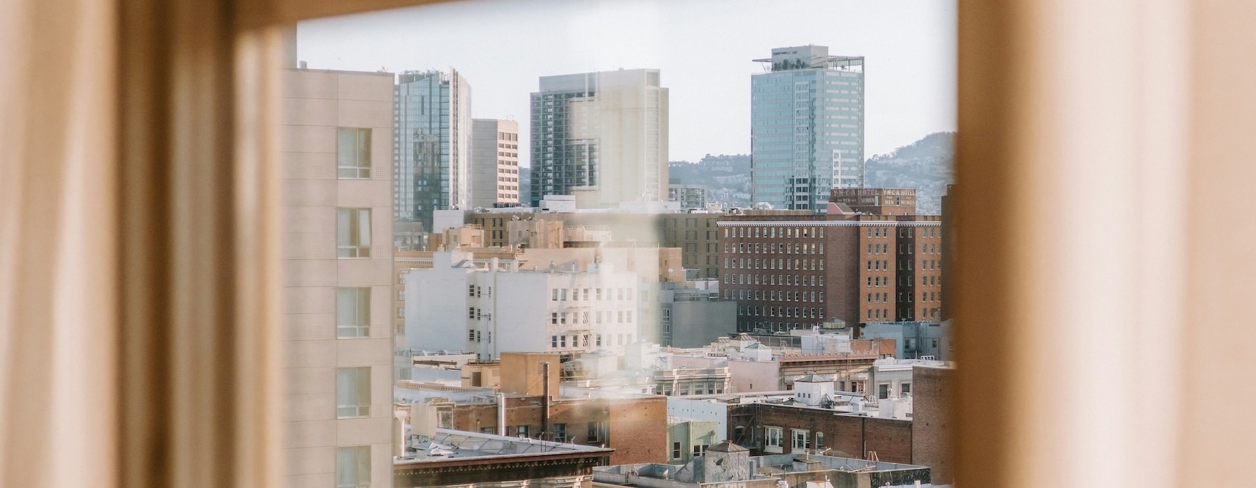 a window with a view of a city