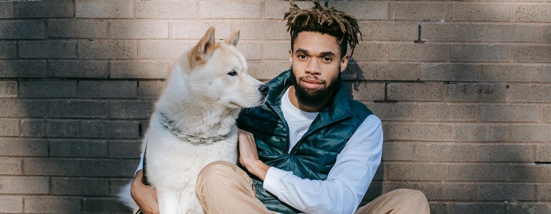 a person sitting with a dog