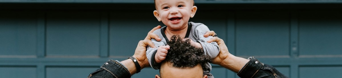 a man holding his son